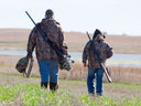 grandpa and grandson hunting in cold weather